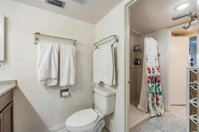 a bathroom with a sink vanity and a mirror