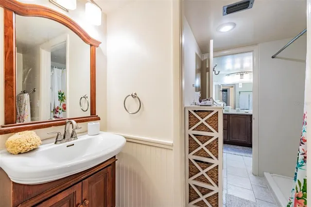 a bedroom with furniture and a tv