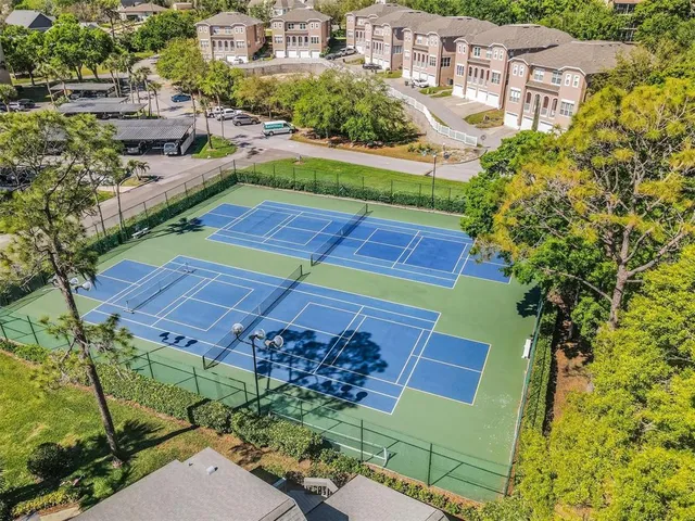 an aerial view of a house with garden space and outdoor seating