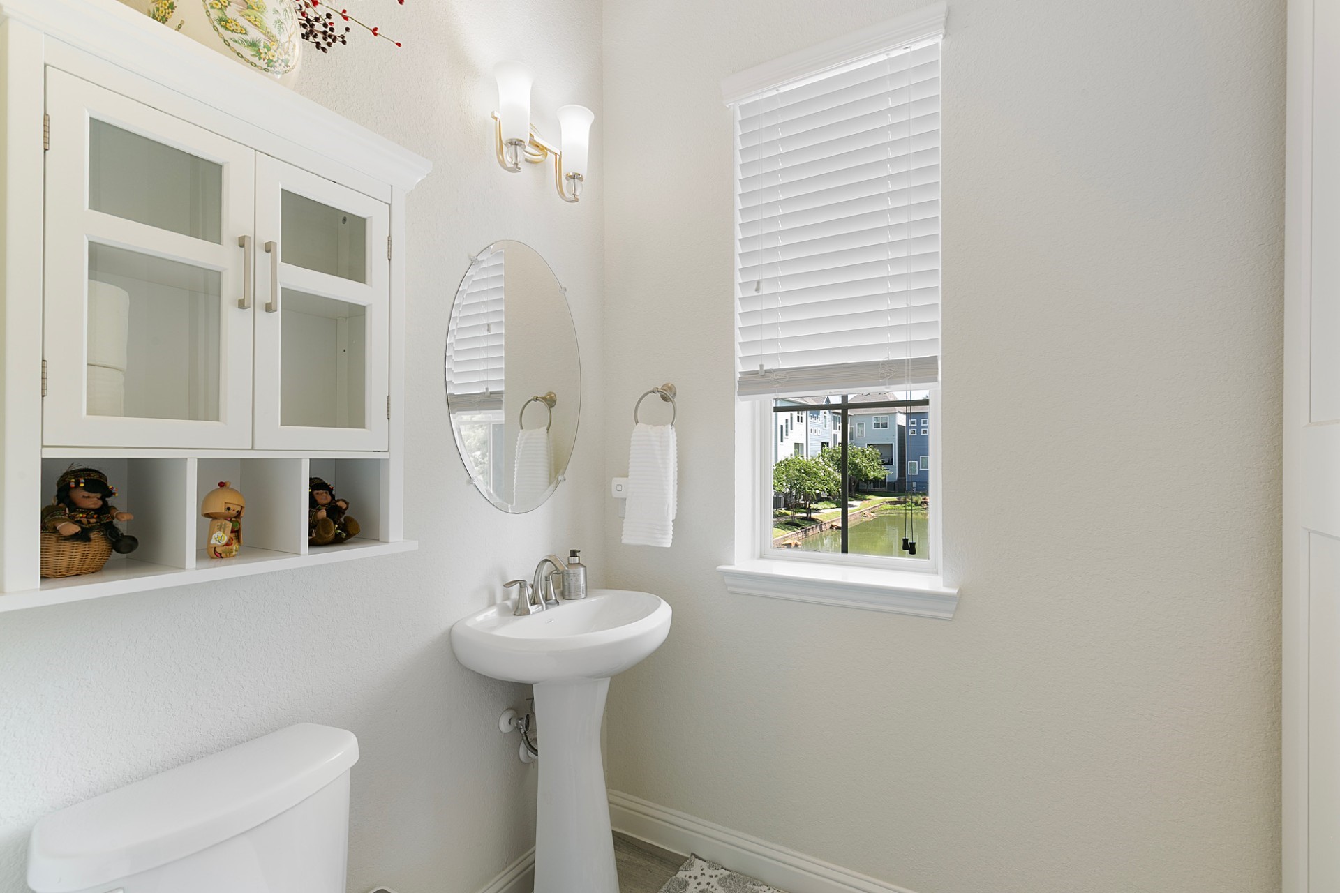 1415 Maple Stream Drive Houston, TX 77043 - Photo 11 of 29 a bathroom with a sink a mirror and a window