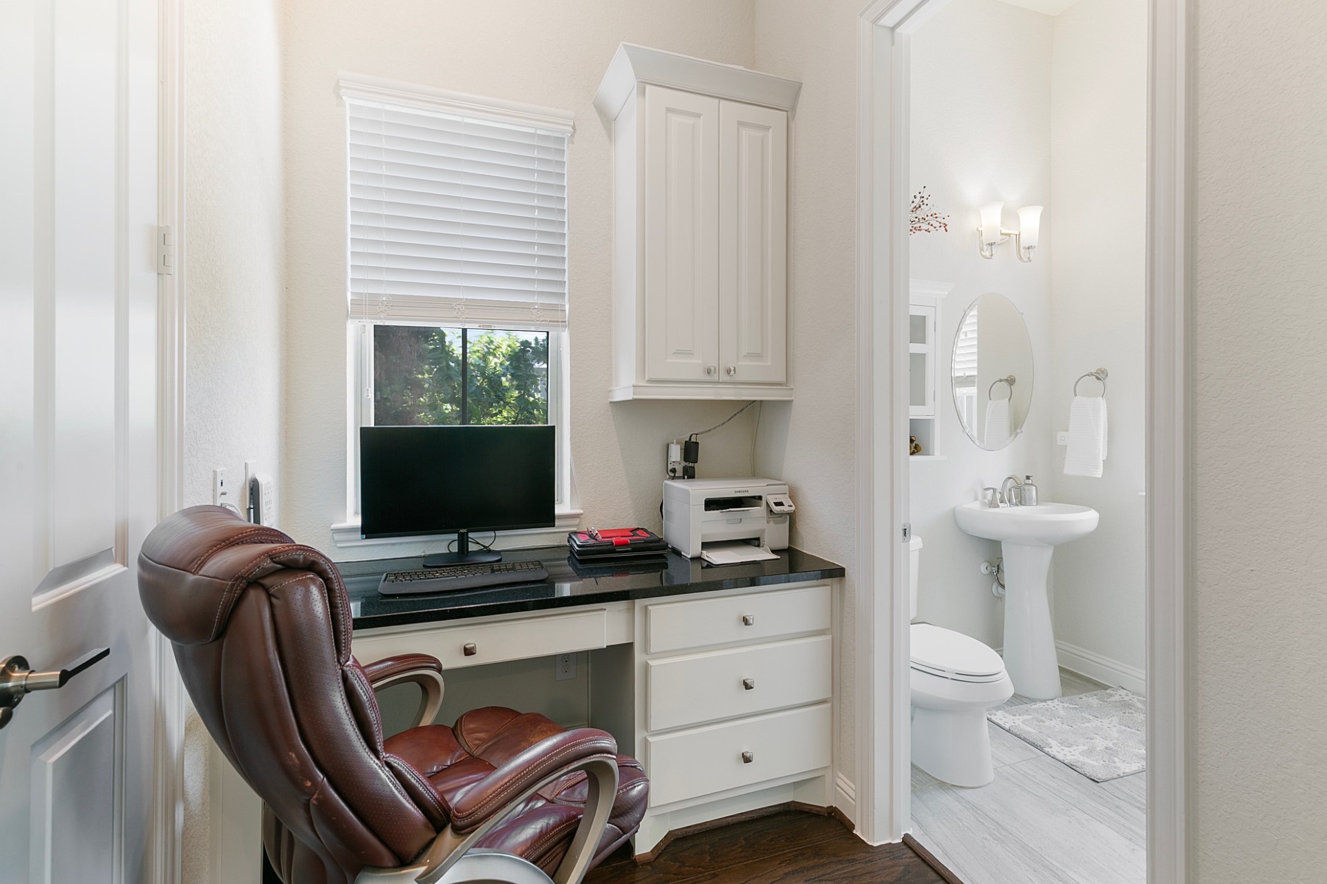 1415 Maple Stream Drive Houston, TX 77043 - Photo 12 of 29 a view of a workspace with furniture and a window