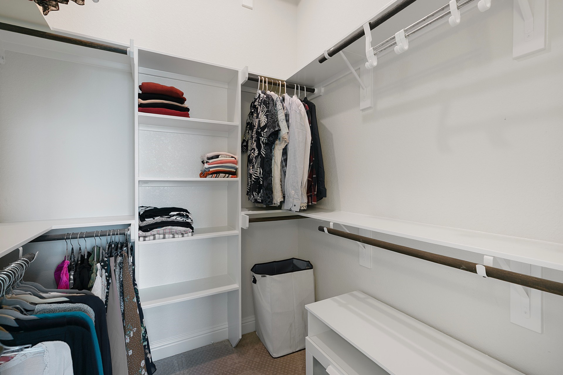 1415 Maple Stream Drive Houston, TX 77043 - Photo 18 of 29 a view of walk in closet with clothes and shoes