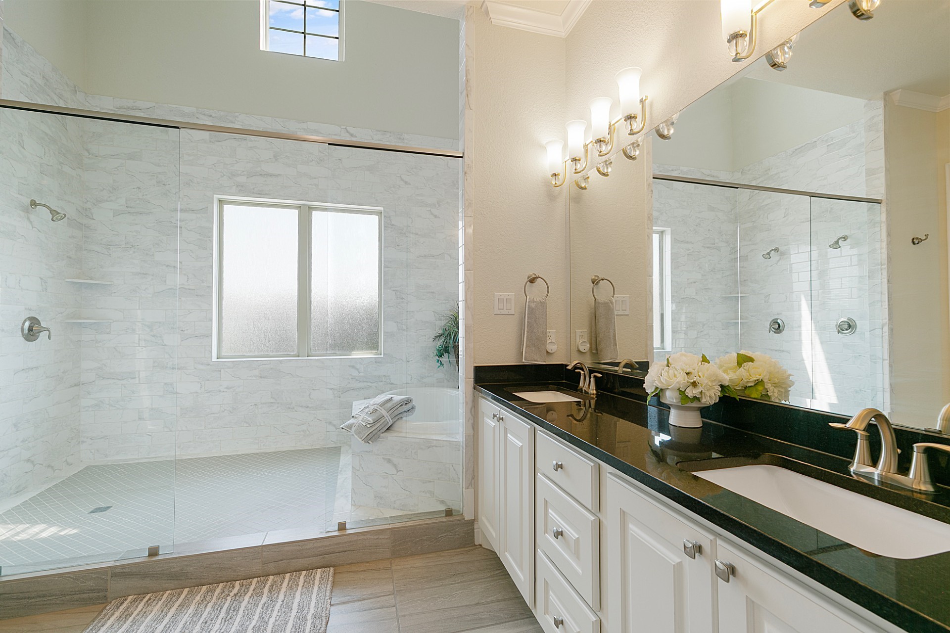 1415 Maple Stream Drive Houston, TX 77043 - Photo 21 of 29 a spacious bathroom with double sink and a mirror
