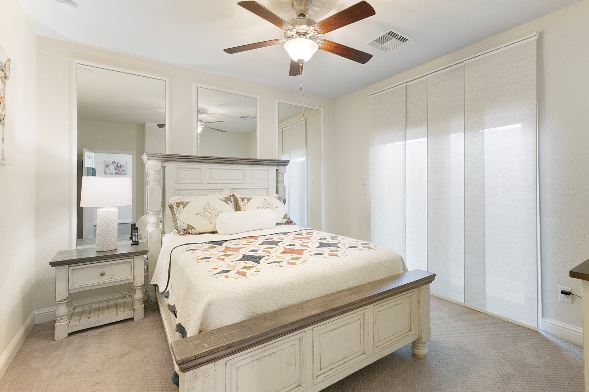 1415 Maple Stream Drive Houston, TX 77043 - Photo 4 of 29 a bedroom with a bed and a chandelier