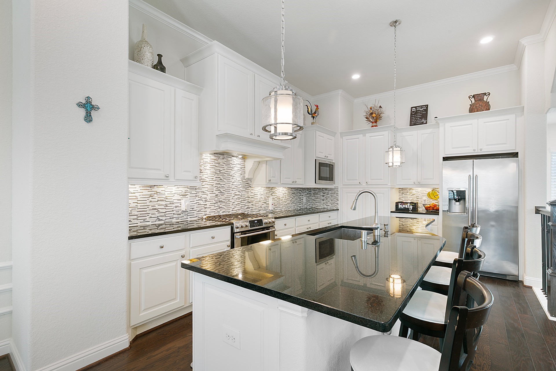 1415 Maple Stream Drive Houston, TX 77043 - Photo 7 of 29 a kitchen with granite countertop a sink appliances and cabinets