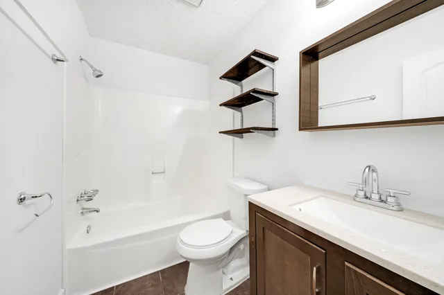 a bathroom with a sink a toilet and a bathtub