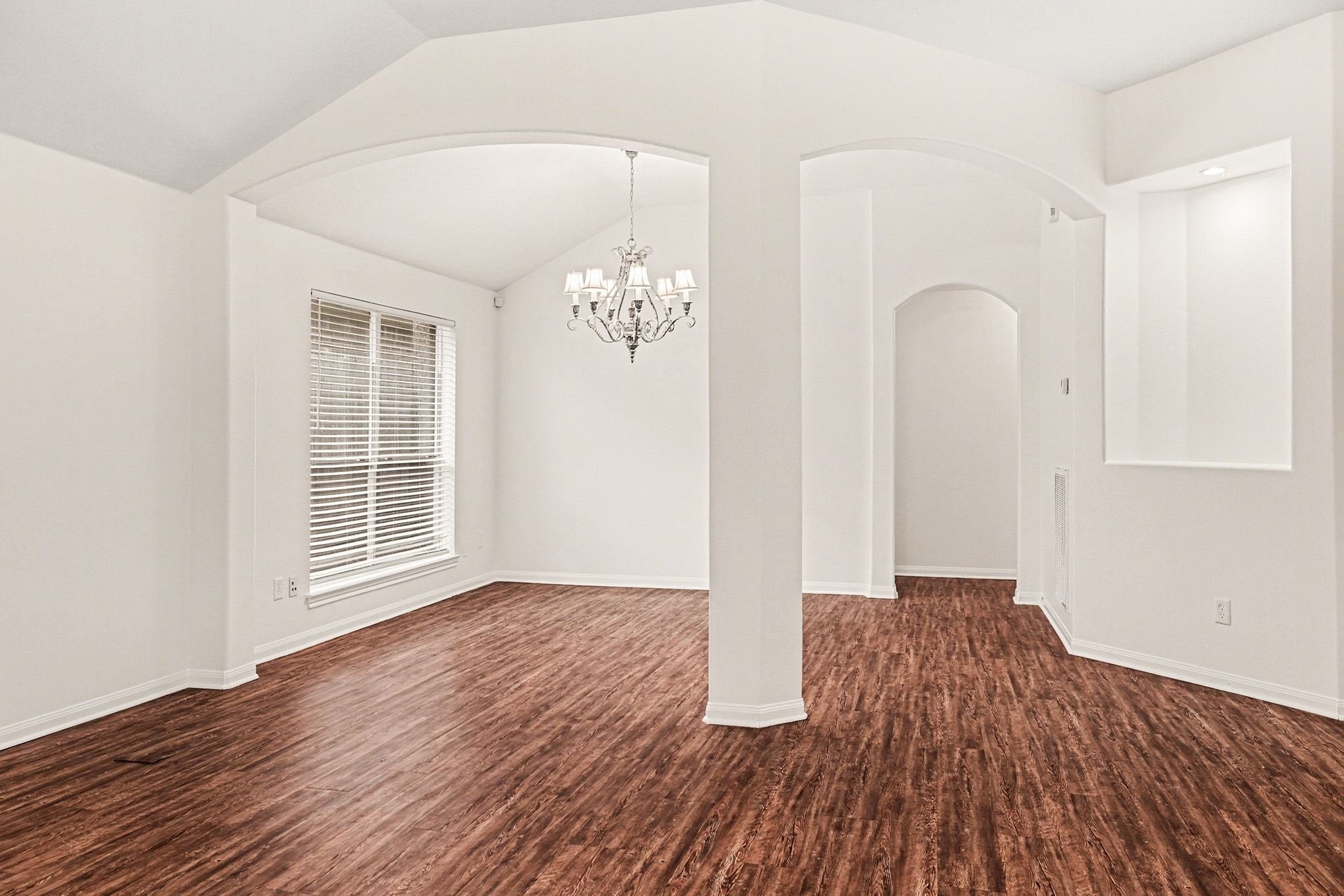 3218 Woodchuck Road Montgomery, TX 77356 - Photo 12 of 27 wooden floor in an empty room with a window
