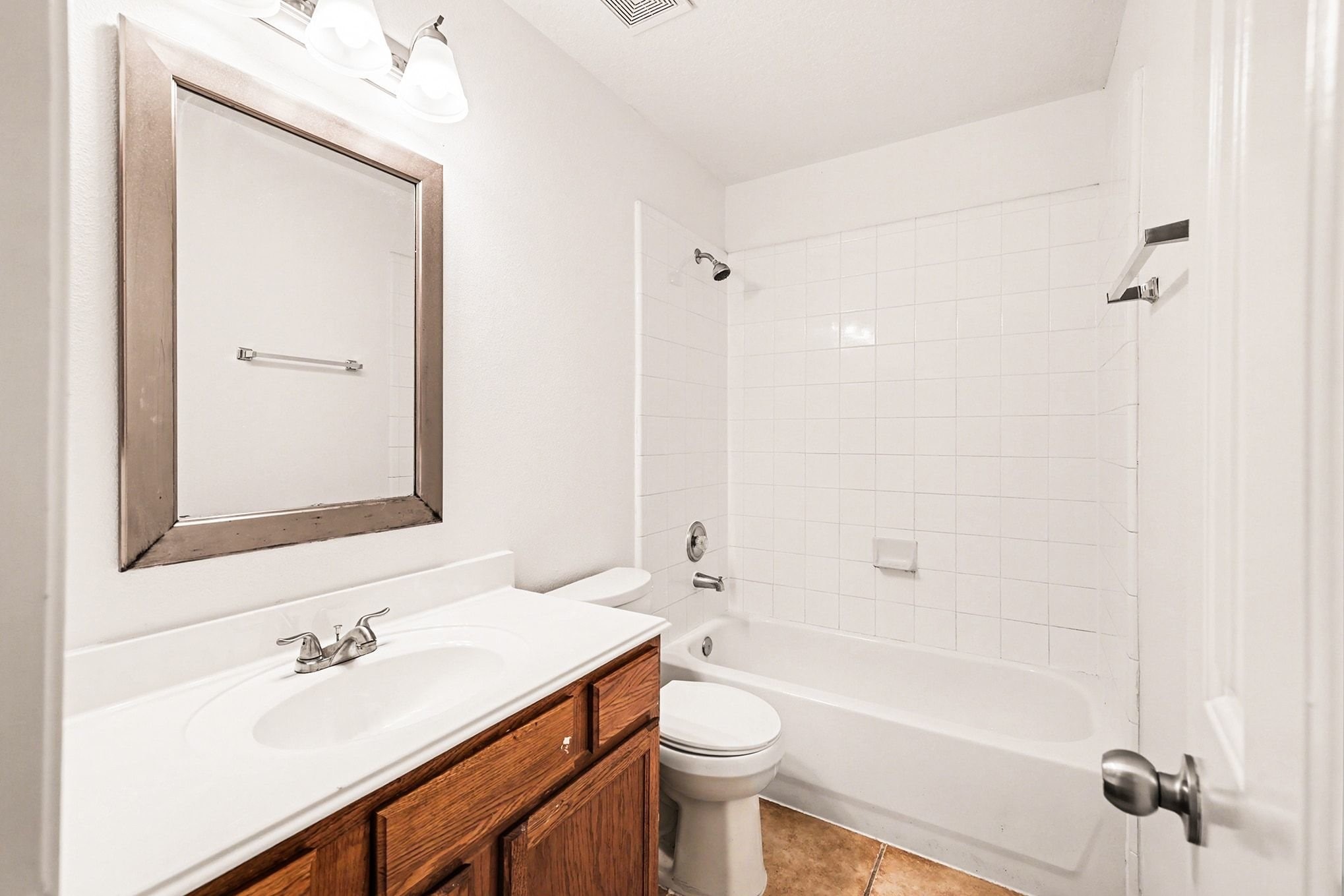 3218 Woodchuck Road Montgomery, TX 77356 - Photo 16 of 27 a bathroom with a sink a toilet and shower