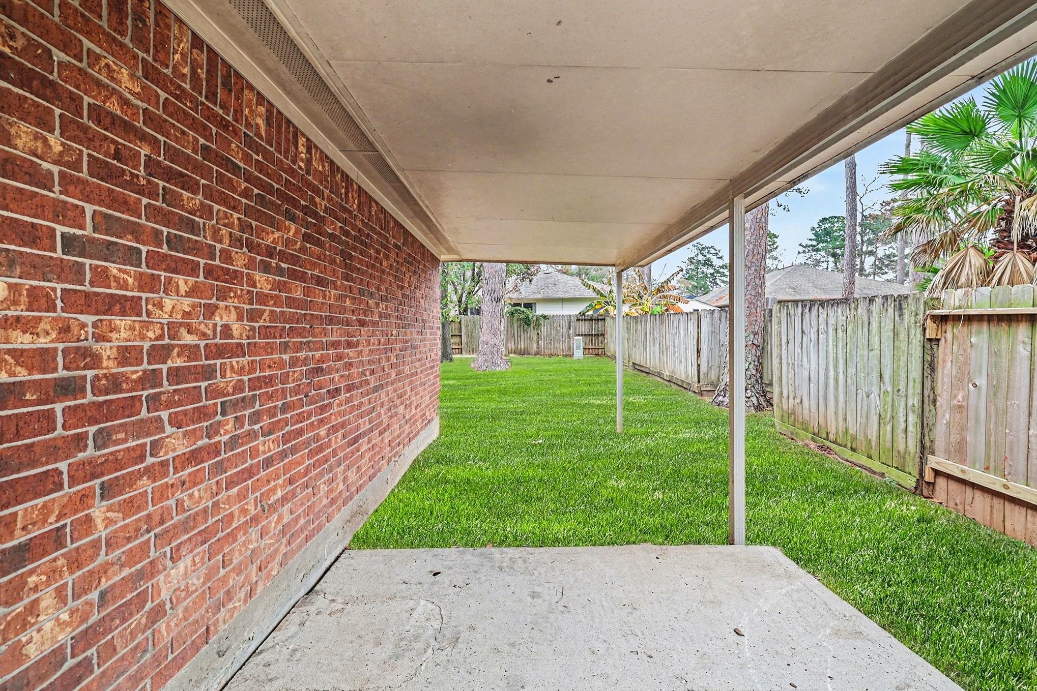 3218 Woodchuck Road Montgomery, TX 77356 - Photo 26 of 27 a view of a backyard with a garden