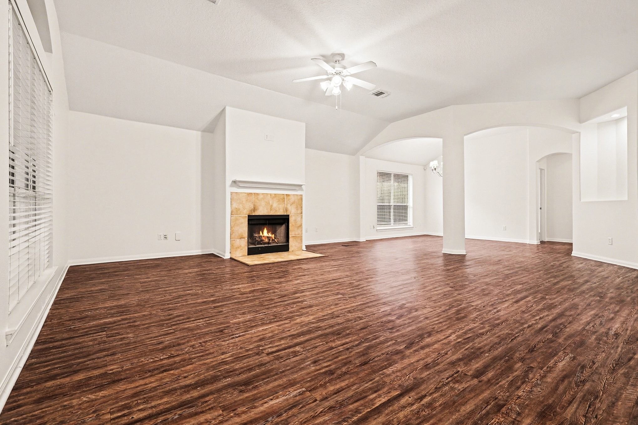 3218 Woodchuck Road Montgomery, TX 77356 - Photo 5 of 27 a view of an empty room with chandelier and fireplace