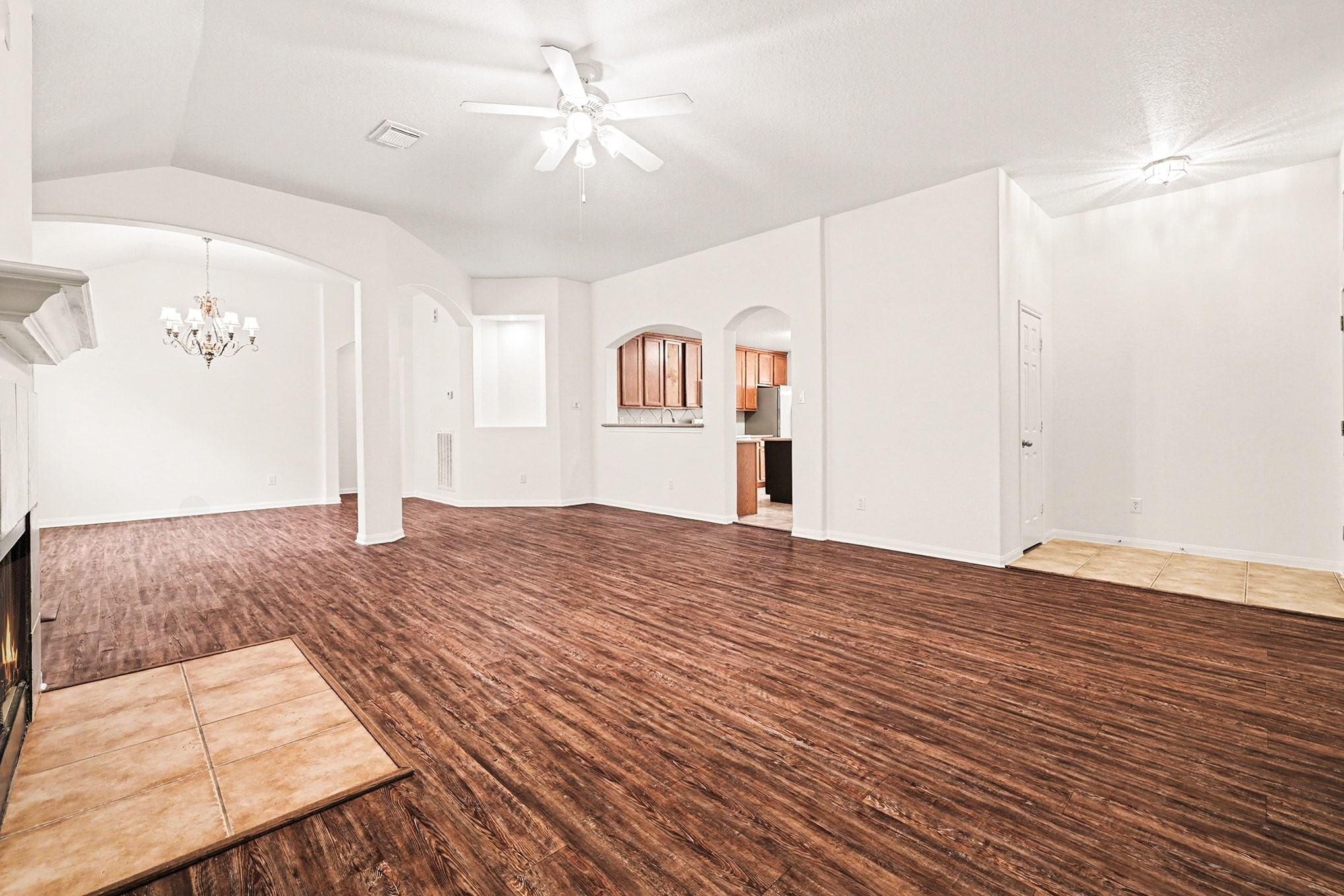 3218 Woodchuck Road Montgomery, TX 77356 - Photo 6 of 27 a bedroom with a large bed and a chandelier