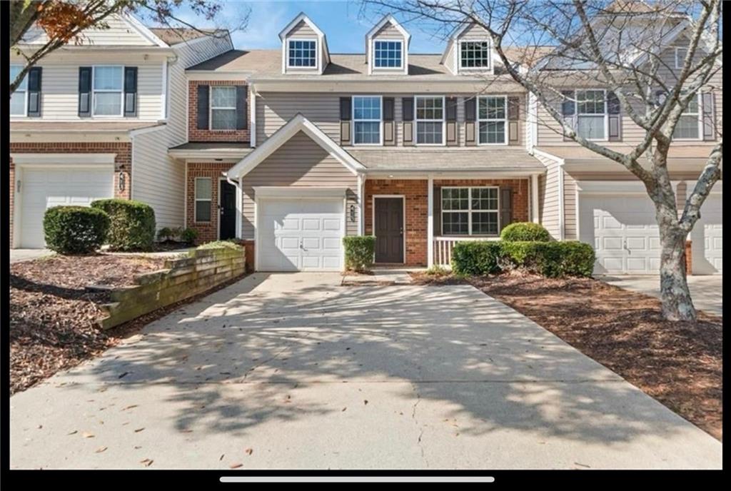 415 Weatherstone Place Alpharetta, GA 30004 - Photo 1 of 1 a front view of a house with a yard