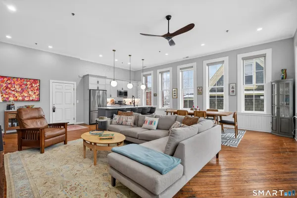 a living room with furniture and a large window