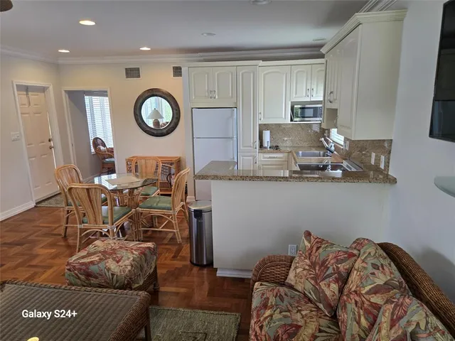 a living room with furniture and a clock