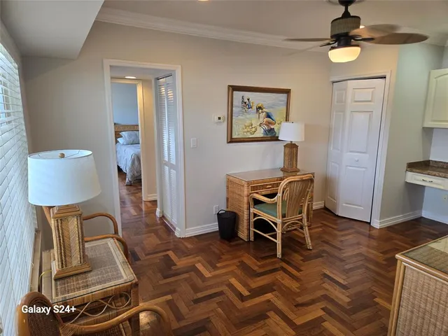 a room with furniture a flat screen tv and rug