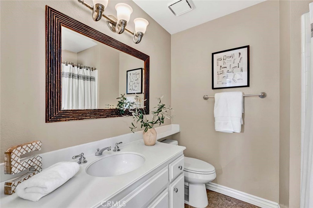 2489 Via Castillo Tustin, CA 92782 - Photo 14 of 30 a bathroom with a sink a toilet and mirror