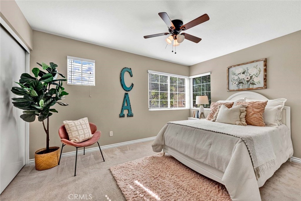 2489 Via Castillo Tustin, CA 92782 - Photo 15 of 30 a bedroom with a bed potted plant and a window