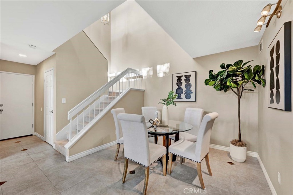 2489 Via Castillo Tustin, CA 92782 - Photo 5 of 30 a view of a dining room with furniture and a potted plant