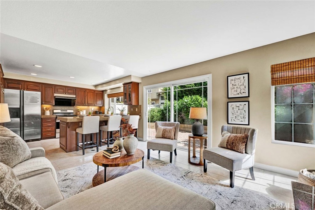 2489 Via Castillo Tustin, CA 92782 - Photo 9 of 30 a living room with furniture kitchen view and large windows