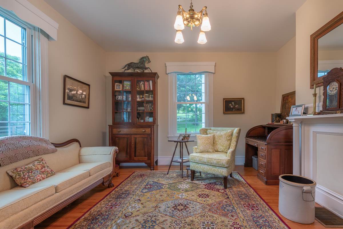 227 Middlebrook Road Staunton, VA 24401 - Photo 17 of 50 a living room with furniture a chandelier and a window