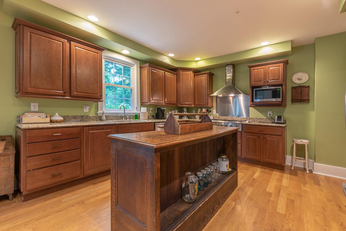 227 Middlebrook Road Staunton, VA 24401 - Photo 20 of 50 a kitchen with a stove a sink and a refrigerator