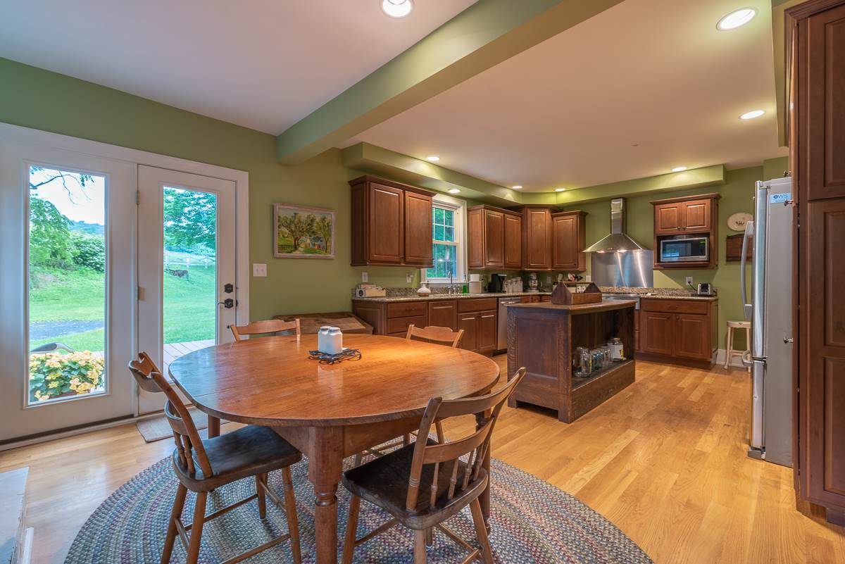 227 Middlebrook Road Staunton, VA 24401 - Photo 23 of 50 a kitchen with a table and chairs in it