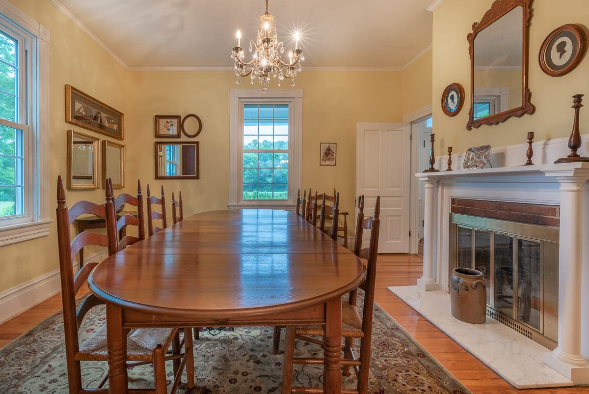 227 Middlebrook Road Staunton, VA 24401 - Photo 27 of 50 a dining room with furniture a floor to ceiling window and wooden floor