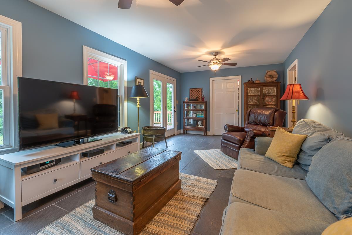 227 Middlebrook Road Staunton, VA 24401 - Photo 33 of 50 a living room with furniture and a flat screen tv