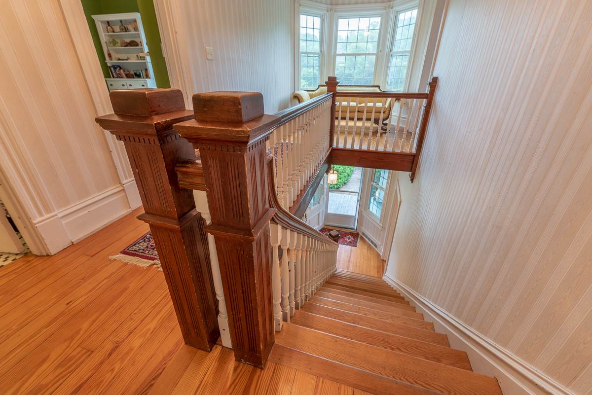 227 Middlebrook Road Staunton, VA 24401 - Photo 35 of 50 a view of a hallway with wooden floor and stairs