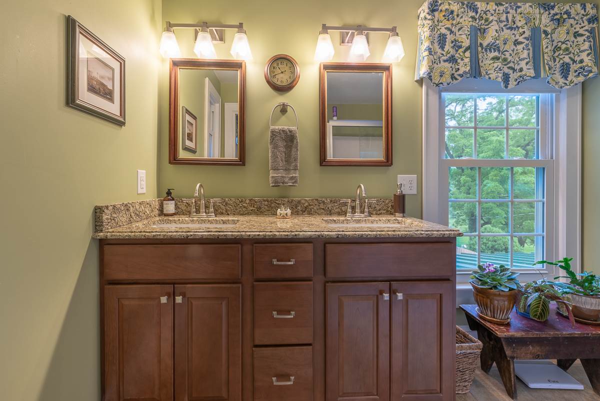 227 Middlebrook Road Staunton, VA 24401 - Photo 39 of 50 a bathroom with a granite countertop sink and a large mirror