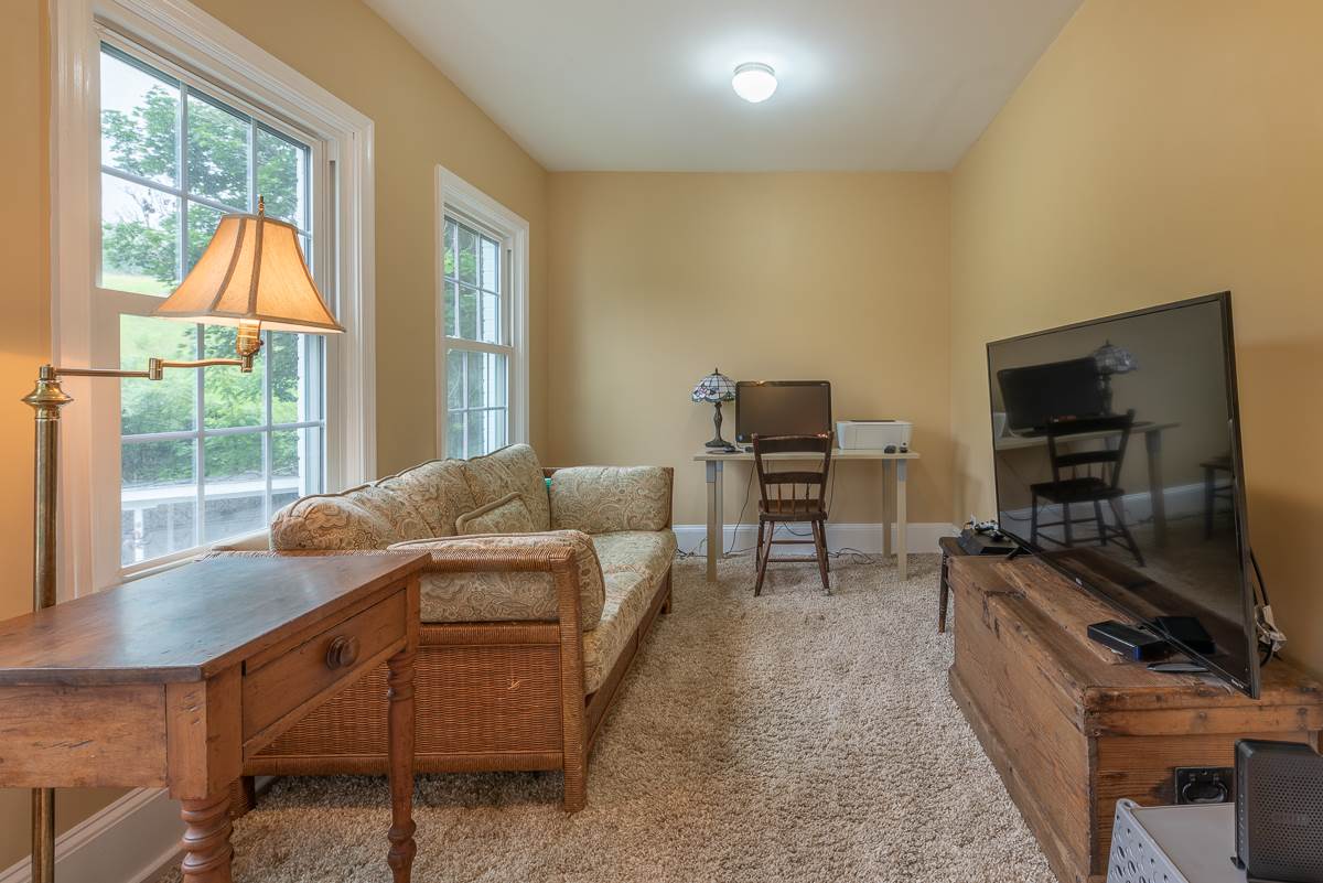227 Middlebrook Road Staunton, VA 24401 - Photo 48 of 50 a living room with furniture and a flat screen tv