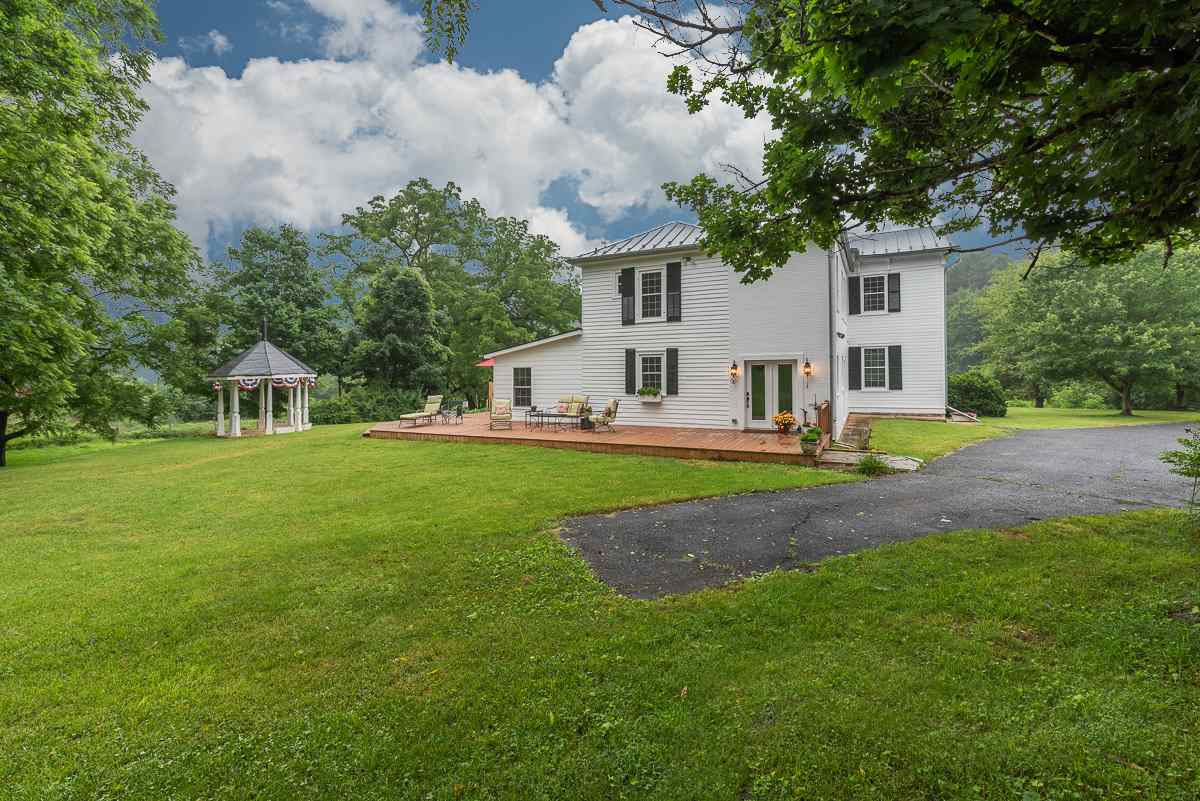 227 Middlebrook Road Staunton, VA 24401 - Photo 7 of 50 a view of a house with a big yard and large trees