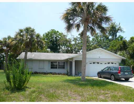 675 Treasure Road Venice, FL 34293 - Photo 1 of 1 a front view of a house with a garden and trees