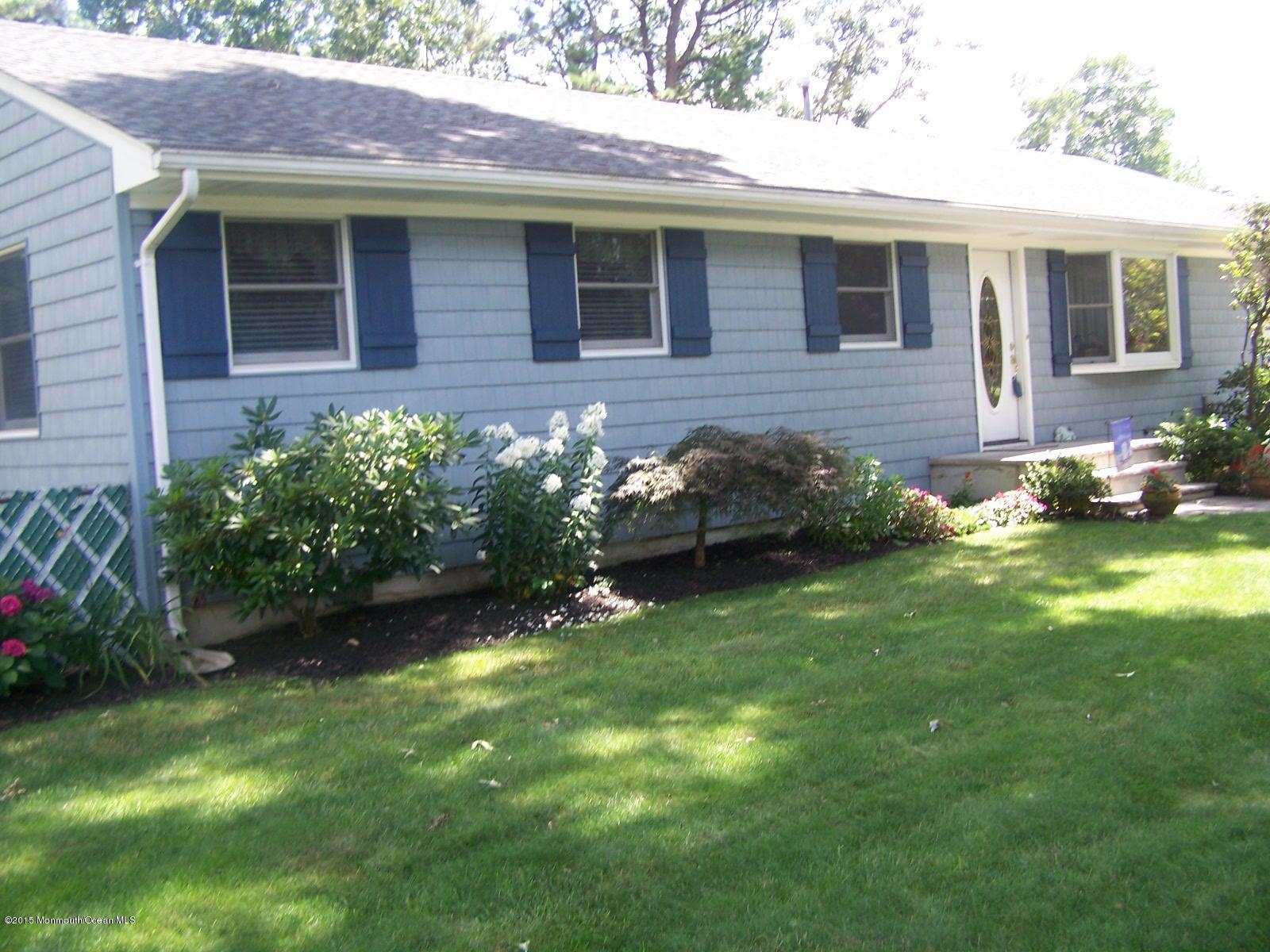 657 Thoroughfare Road Brick, NJ 08724 - Photo 1 of 23 a front view of a house with garden