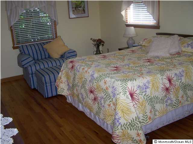 657 Thoroughfare Road Brick, NJ 08724 - Photo 18 of 23 a bedroom with a bed and a window