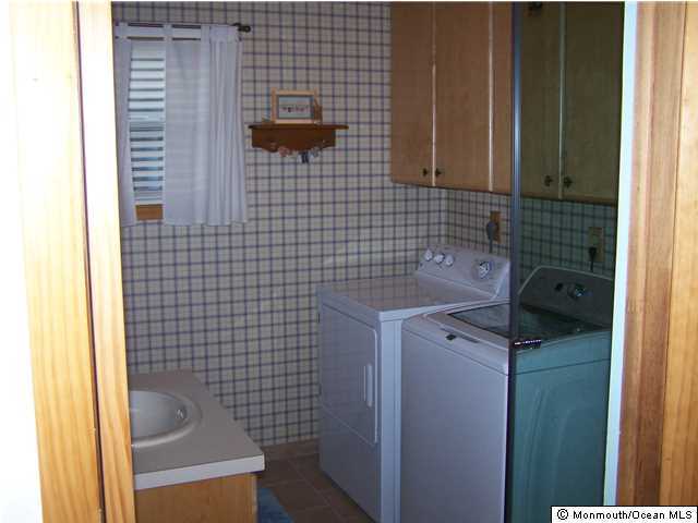 657 Thoroughfare Road Brick, NJ 08724 - Photo 19 of 23 a bathroom with a sink and a shower