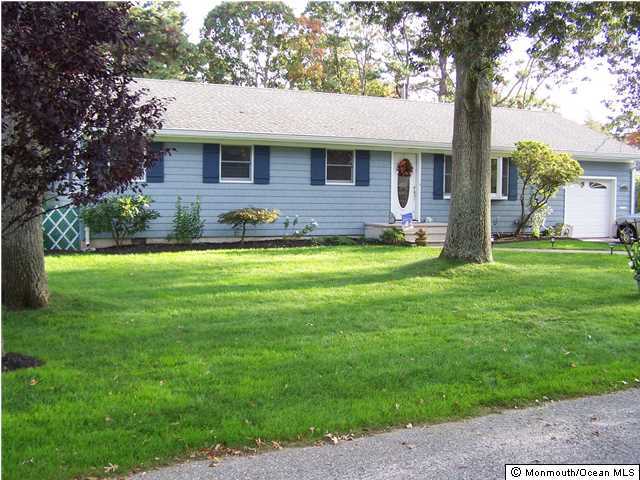 657 Thoroughfare Road Brick, NJ 08724 - Photo 2 of 23 a view of a house with a yard patio and a tree