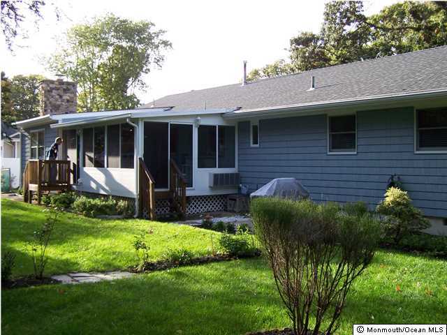 657 Thoroughfare Road Brick, NJ 08724 - Photo 3 of 23 a view of a house with a yard and plants