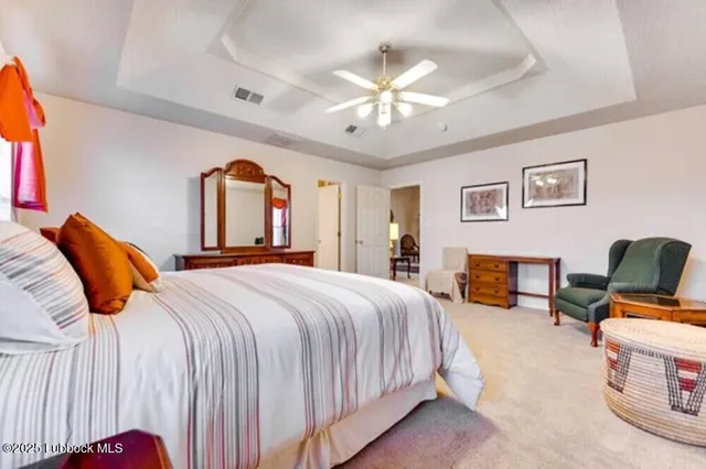 a bedroom with bed and window