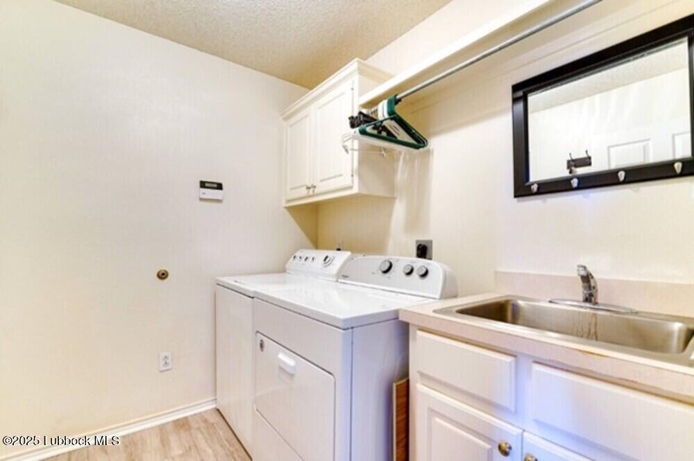 5914 88th Place Lubbock, TX 79424 - Photo 19 of 22 a utility room with dryer and washer