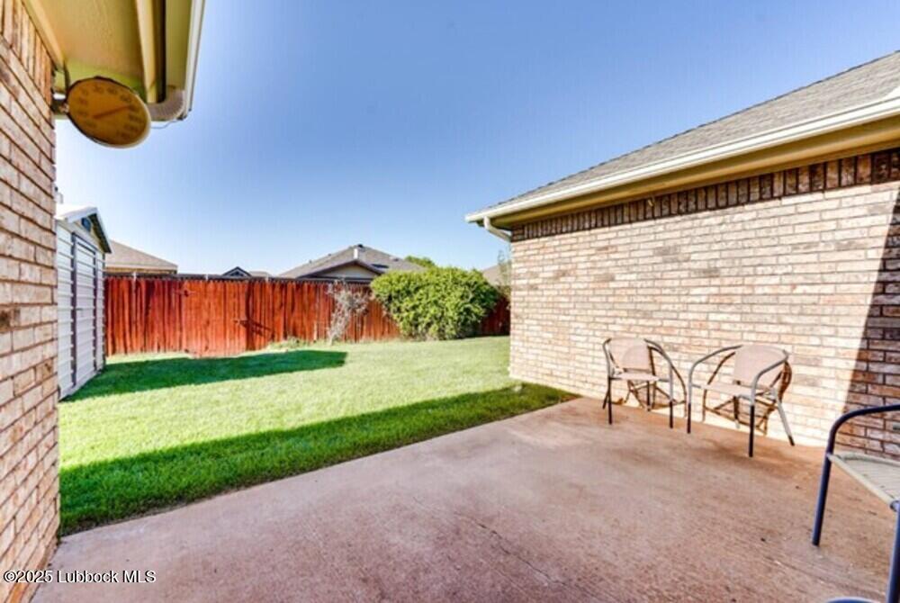 5914 88th Place Lubbock, TX 79424 - Photo 22 of 22 a backyard of a house with table and chairs