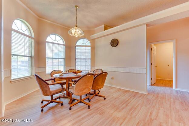 5914 88th Place Lubbock, TX 79424 - Photo 6 of 22 a view of a dining room with furniture window and wooden floor