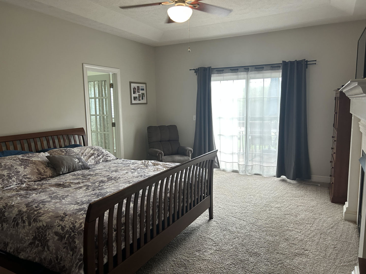 1008 Stuart Drive Heyworth, IL 61745 - Photo 14 of 32 a bedroom with a bed and a chandelier