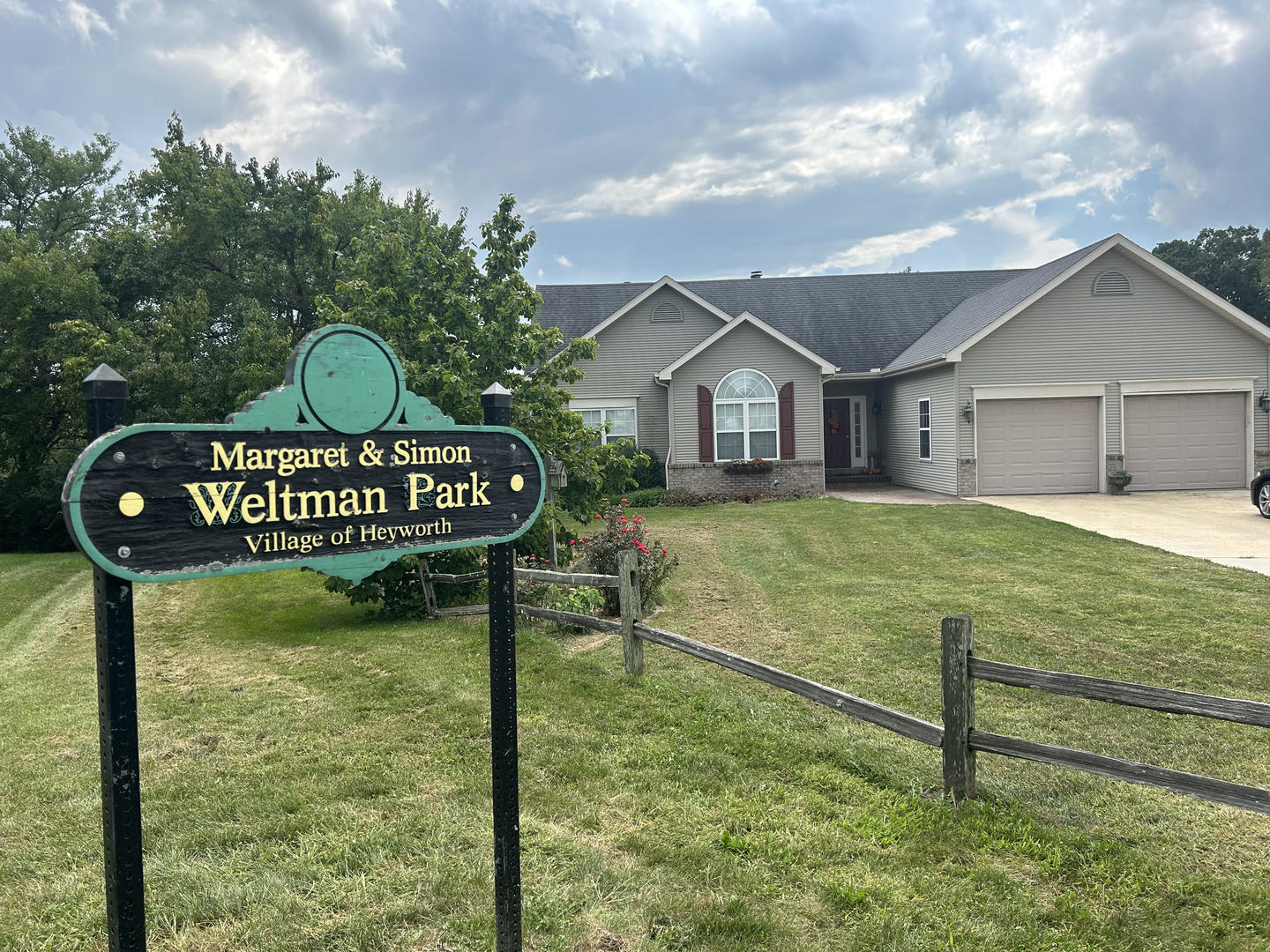 1008 Stuart Drive Heyworth, IL 61745 - Photo 2 of 32 a view of a house with a yard and wooden fence