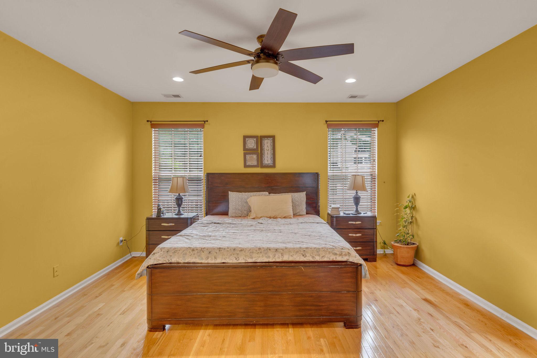 16 Cardiff Court Princeton Junction, NJ 08550 - Photo 23 of 60 a spacious bedroom with a bed and wooden floor