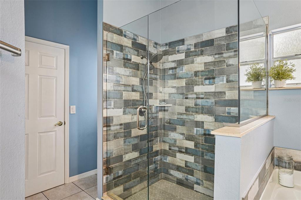 2052 Onecco Court Clermont, FL 34714 - Photo 15 of 33 a bathroom with a shower