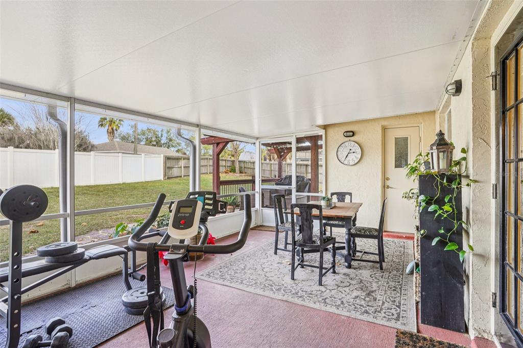 2052 Onecco Court Clermont, FL 34714 - Photo 22 of 33 a view of a dining room with a table and chairs
