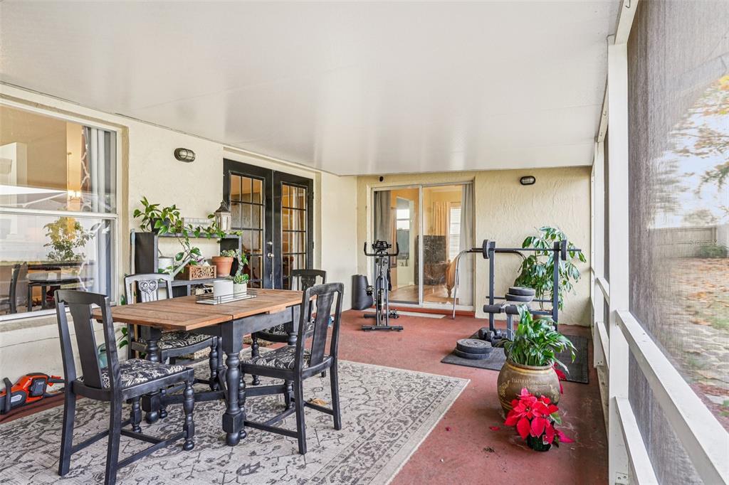 2052 Onecco Court Clermont, FL 34714 - Photo 23 of 33 a view of a dining room with furniture window and wooden floor