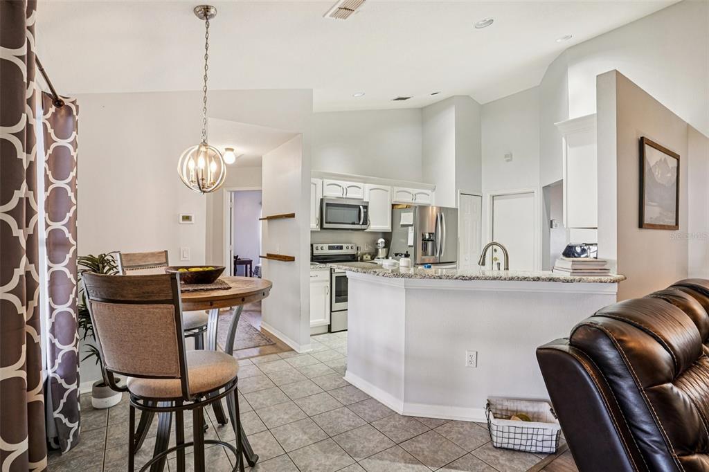 2052 Onecco Court Clermont, FL 34714 - Photo 7 of 33 a view of a dining room with furniture and chandelier