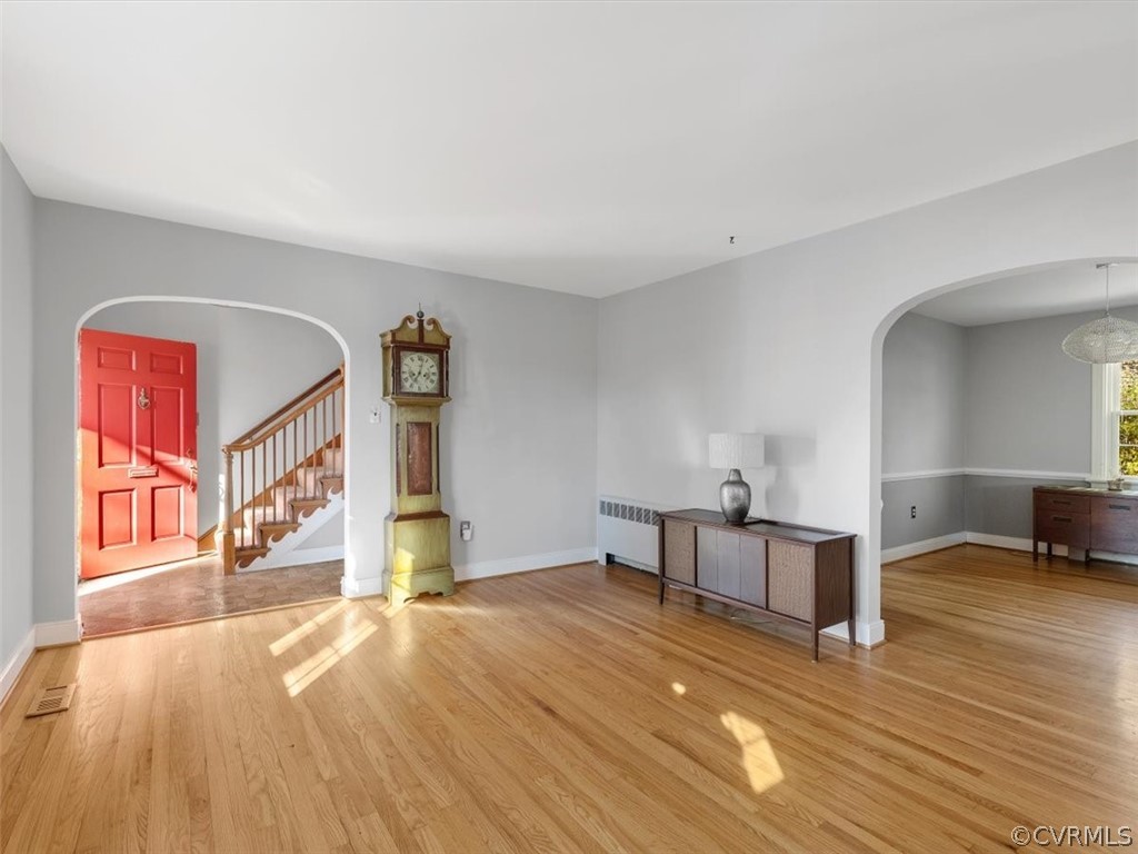 Living room looking into the entrance (L) and the